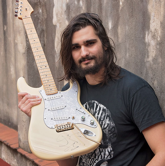 César Ambrossi guitarist is showing us a VegaTrem tremolo on his guitar