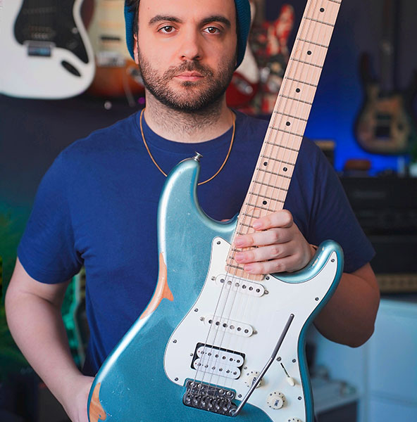 Danilo Vicari is holding a guitar with a VegaTrem tremolo