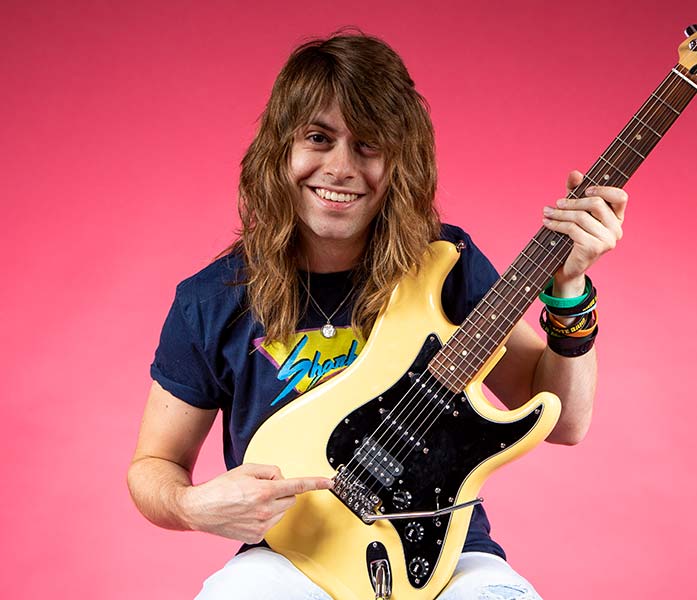 Guitarist Ben Cote is pointing the VegaTrem tremolo on his stratocaster